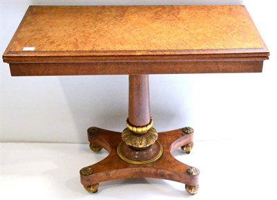 Lot 983 - A George IV Amboyna Card Table, in the manner of T&G Seddon, the rectangular swivel top raised on a