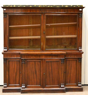 Lot 992 - A William IV Mahogany Bookcase, the faux marble plinth top and moulded cornice over two wire-grille