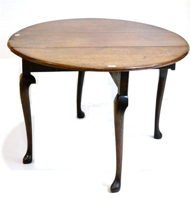 Lot 1003 - A George III Mahogany Dropleaf Dining Table, circa 1760, the two rounded leaves above a...