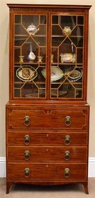 Lot 1004 - A George III Mahogany and Inlaid Secretaire Bookcase, the upper part with a moulded cornice...