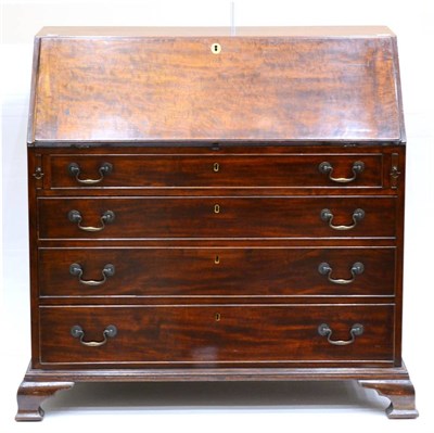 Lot 1006 - A George III Mahogany Bureau, the slope enclosing a well-fitted interior over four long drawers, on