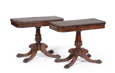 Lot 1012 - A Near Pair of George IV Rosewood Card Tables, the D-shaped swivel tops with beaded edges,...