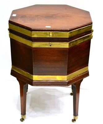 Lot 1013 - A George III Mahogany and Brass Bound Octagonal Shaped Wine Cooler, circa 1790, the hinged lid...