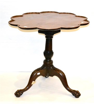 Lot 1018 - A George II Mahogany Tripod Table, the circular lobed and dished top on a birdcage support and...