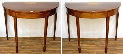 Lot 1026 - A Pair of George III Style Mahogany, Kingwood and Tulipwood Banded Demi-Lune Hall Tables, raised on