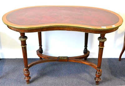 Lot 1031 - A Victorian Walnut and Metal-Mounted Writing Table, the kidney-shaped top inset with red...