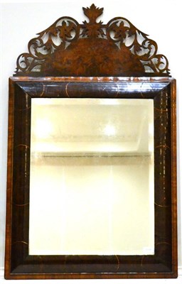 Lot 1034 - An Oyster Olivewood Mirror, the bevelled rectangular plate within a cushion-moulded frame...