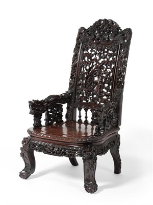 Lot 1046 - A Late 19th Century Chinese Carved Hardwood Dragon Armchair, the foliate carved back panel...