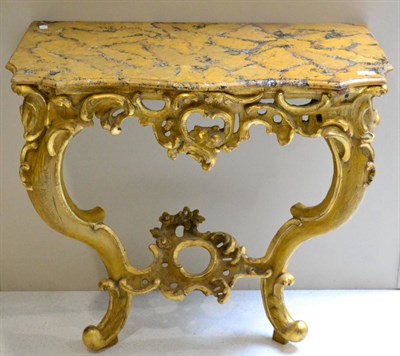 Lot 1050 - A 19th Century Italian Gilt and Gesso Console Table, the yellow and black veined marble top above a