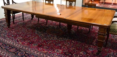 Lot 1053 - A Late Victorian Walnut Extending Dining Table, circa 1880, of rectangular canted form, with...