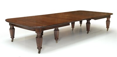 Lot 1054 - A Late Victorian Mahogany Wind-Out Dining Table, the round-cornered top on moulded rails and...