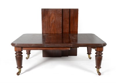 Lot 1055 - A Victorian Mahogany Wind-Out Dining Table, the round cornered top with a deep, moulded edge,...