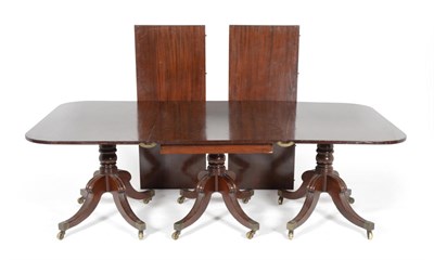 Lot 1063 - A Regency Mahogany Three-Pillar Dining Table, comprising two D ends and a rectangular centre,...