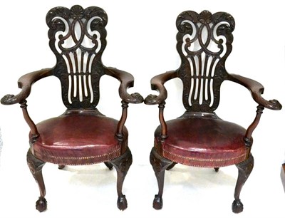 Lot 1074 - A Pair of Victorian Carved Mahogany Library Armchairs, late 19th century, with pierced and...