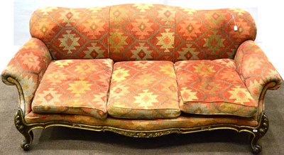 Lot 1075 - A Victorian Walnut and Parcel Gilt Serpentine Shaped Three Seater Sofa, stamped Holland & Sons,...