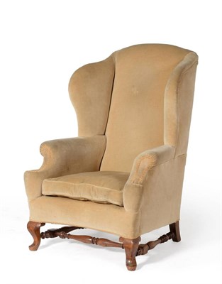 Lot 1079 - A 19th Century Wing Back Armchair, stamped Howard & Sons Ltd, Berners Street, numbered 3793,...