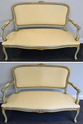 Lot 1084 - A Pair of Louis XV Style Green and Parcel Gilt Sofas, 1st half 20th century, recovered in cream and