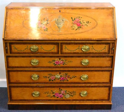 Lot 1111 - An Edwardian Painted Satinwood and Tulipwood Banded Bureau, the slope enclosing a fitted...