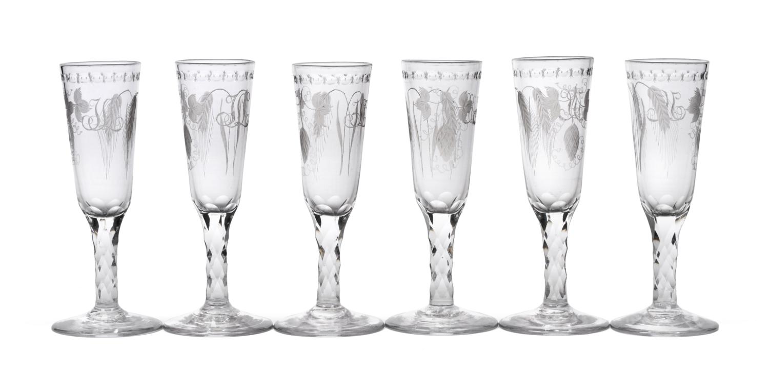 Lot 2 - A Set of Six Ale Flutes, circa 1770, the rounded funnel bowls engraved with hops and...