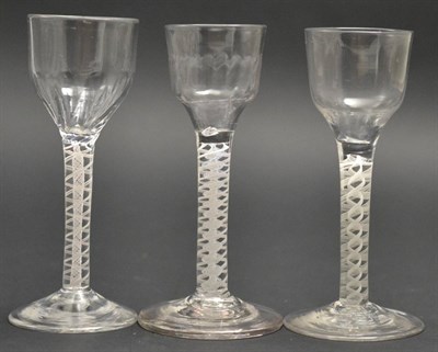 Lot 6 - A Wine Glass, circa 1760, the semi-fluted ogee bowl on an opaque twist stem, 14.5cm high; A Similar