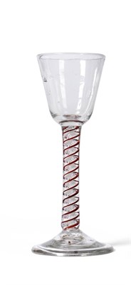 Lot 15 - A Colour Twist Wine Glass, circa 1760, the rounded funnel bowl on a red and white twist stem,...
