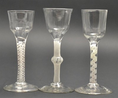 Lot 18 - A Wine Glass, circa 1760, the ogee bowl on a knopped opaque twist stem, 15.5cm high; A Similar...