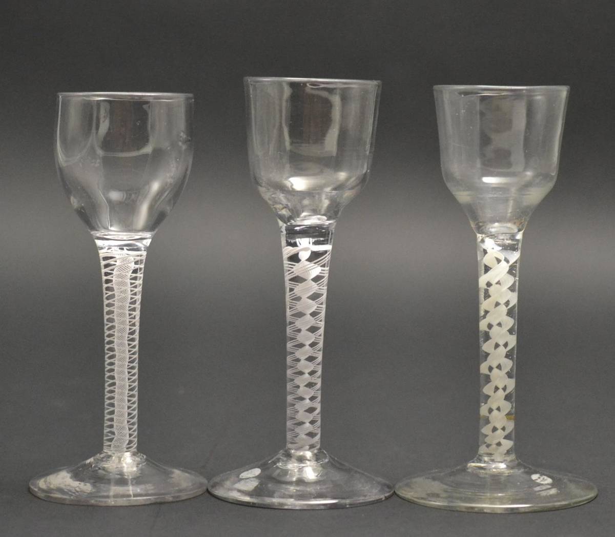 Lot 19 - A Wine Glass, circa 1760, the ogee bowl on an opaque twist stem, 14.5cm high; A Similar Wine Glass