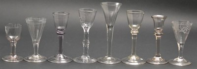 Lot 23 - A Wine Glass, circa 1780, the rounded funnel bowl engraved with flowers on a knopped faceted...