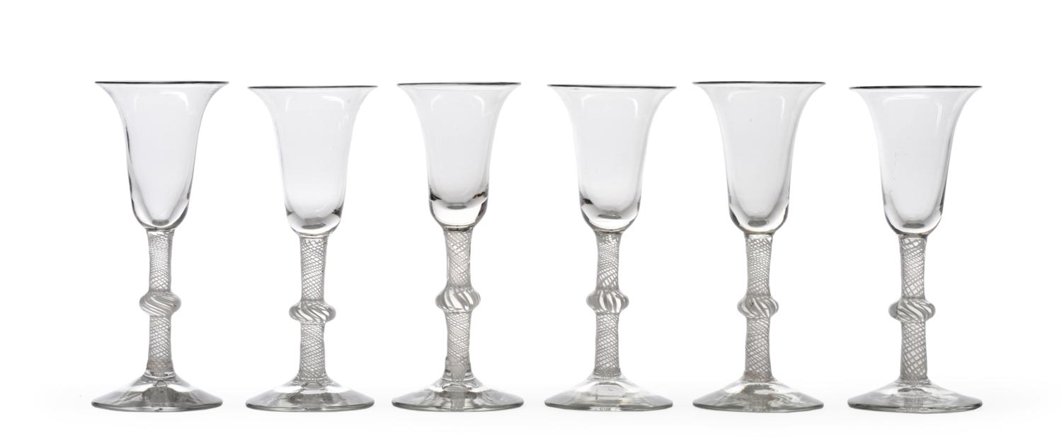 Lot 26 - A Set of Six Wine Glasses, circa 1760, the bell shaped bowls on knopped opaque twist stems,...