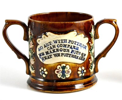 Lot 35 - A Measham Bargeware Loving Cup, dated 1885, inscribed THE POTTERS ARMS 1885 NO ART WITH POTTERS CAN