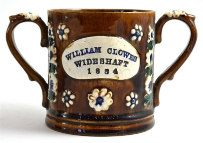 Lot 36 - A Measham Bargeware Loving Cup Frog Mug, dated 1884, of cylindrical form, inscribed WILLIAM CLOWES