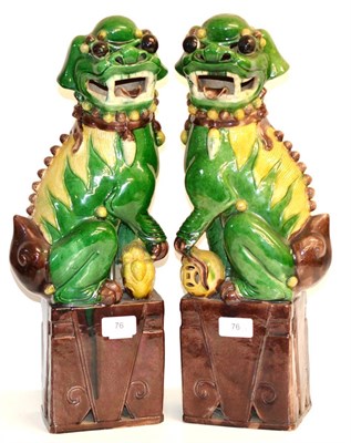 Lot 76 - A Pair of Chinese Porcelain Dogs of Fo, in Kangxi style, decorated in sancai glazes, 45cm high