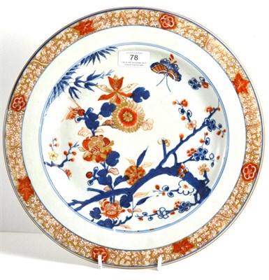 Lot 78 - A Chinese Imari Porcelain Charger, Kangxi, painted with a butterfly amongst flowering branches...