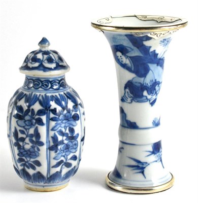 Lot 83 - A Chinese Porcelain Small Vase and Cover, Kangxi, of fluted baluster form, painted in...