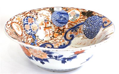 Lot 110 - An Imari Porcelain Basin, Edo period, typically painted with figures in a garden within a broad...