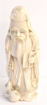 Lot 151 - A Japanese Ivory Okimono, early 20th century, as a sage with long beard and flowing robes holding a