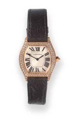 Lot 152 - A Tonneau Shaped 18ct Gold Diamond Set Wristwatch, signed Cartier, model: Tortue, circa 2000,...