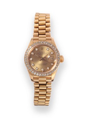 Lot 183 - A Lady's 18ct Gold Diamond Set Automatic Calendar Centre Seconds Wristwatch, signed Rolex,...