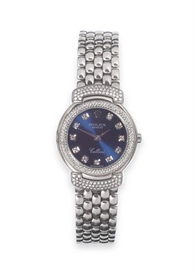 Lot 185 - A Lady's 18ct White Gold Diamond Set Wristwatch, signed Rolex, model: Cellini, ref: 6673/9,...