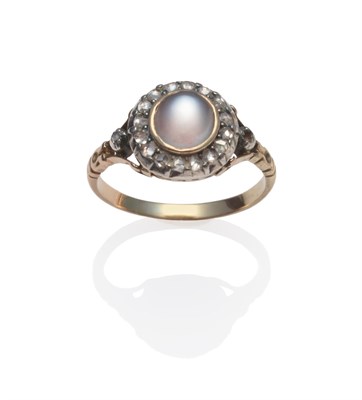 Lot 190 - A Late Victorian Star Moonstone and Diamond Cluster Ring, the round foil backed cabochon...