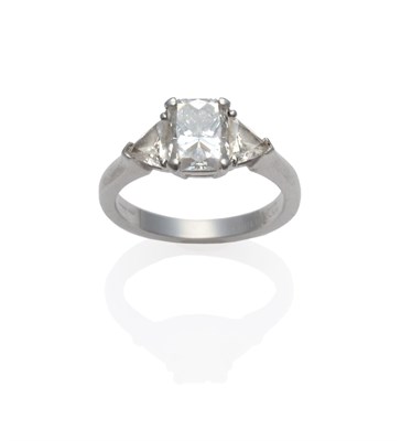 Lot 204 - A Platinum Diamond Ring, a radiant cut diamond with a trillion cut diamond on each side, in...