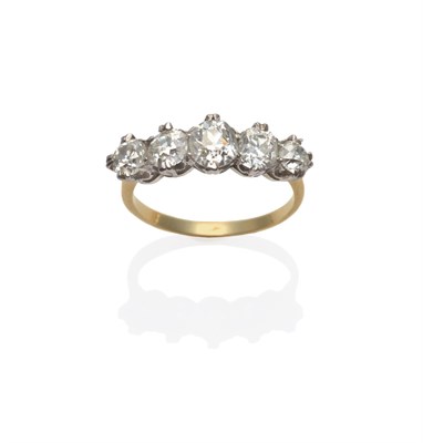 Lot 208 - A Diamond Five Stone Ring, the graduated old cut diamonds in white claw settings, to a yellow...