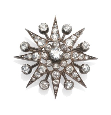 Lot 213 - A Diamond Star Brooch, the old cut diamonds in a central cluster, with eight radial arms,...