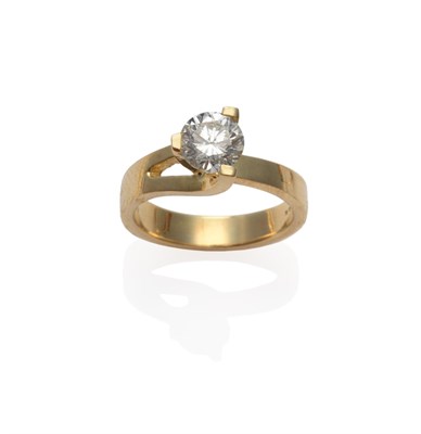 Lot 227 - A Diamond Solitaire Ring, the round brilliant cut diamond in a yellow three claw setting, on a...