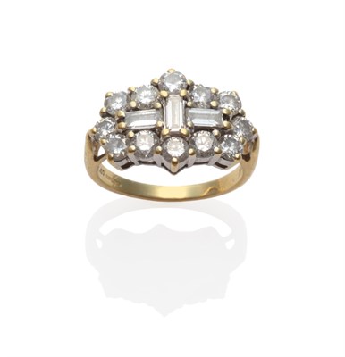 Lot 235 - An 18 Carat Gold Diamond Cluster Ring, three baguette cut diamonds within a border of round...