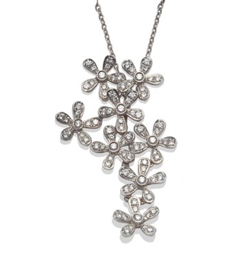 Lot 241 - A Diamond Pendant, the asymmetric pendant of conjoined flower design, set with round brilliant...