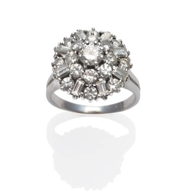 Lot 249 - A Diamond Cluster Ring, a round brilliant cut diamond within a border of round brilliant cut...