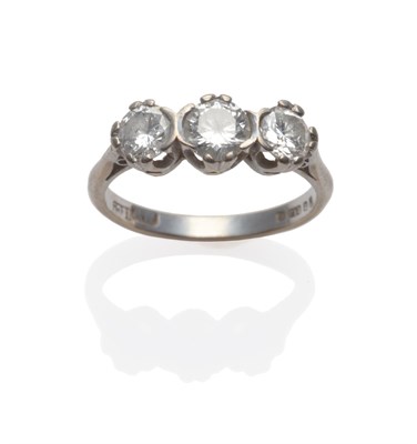 Lot 250 - An 18 Carat White Gold Diamond Three Stone Ring, the round brilliant cut diamonds in white claw...