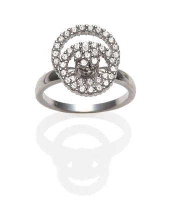 Lot 286 - A Contemporary Diamond 'Motion' Ring, by Teufel, circa 1980, in a circle of life design, a...