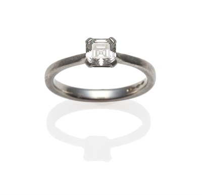 Lot 288 - A Platinum Diamond Solitaire Ring, the Asscher cut diamond in a four claw setting, to a tapered...